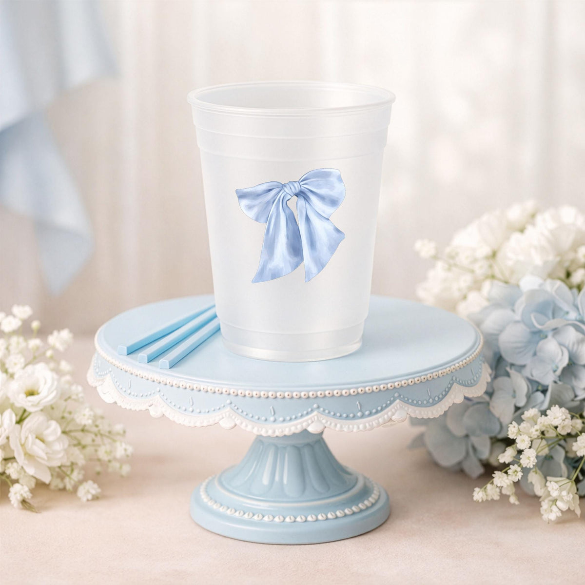 Blue bow frosted party cups for baby shower and birthday