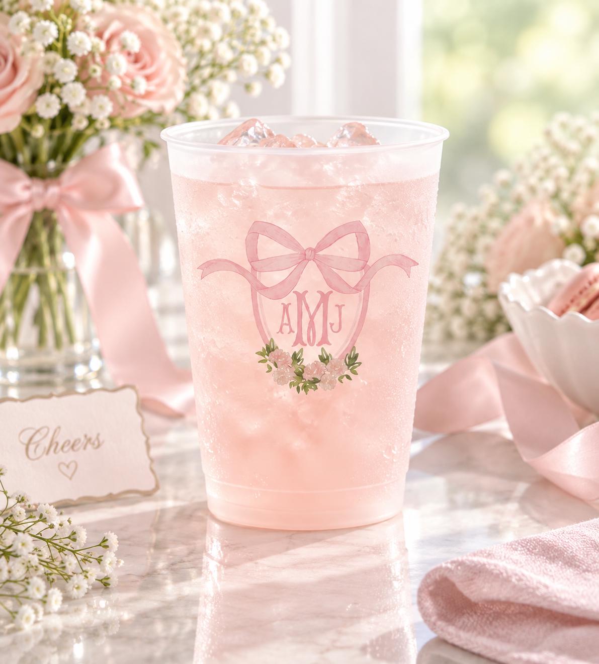 Bow monogram frosted party cups for a baby girl shower