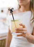 Elegant black bow cocktail stirrers