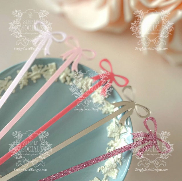 Elegant pink bow cocktail stirrers for parties